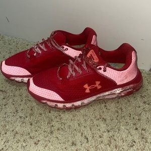 Red under armour reflective tennis shoe.